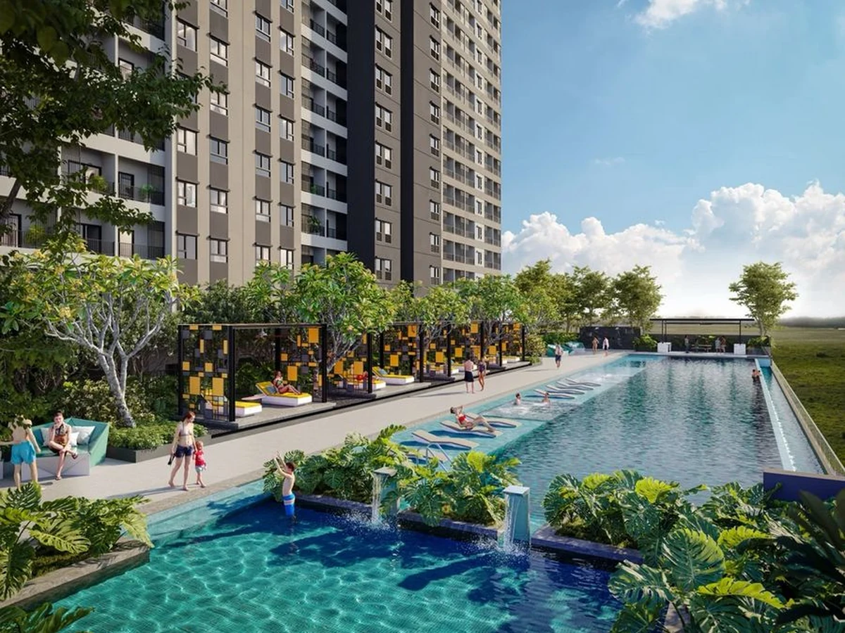 Landscaped pool deck below a modern residential tower